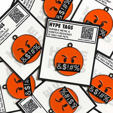 Multiple orange angry face dog tags with Hype Tags packaging showing product details