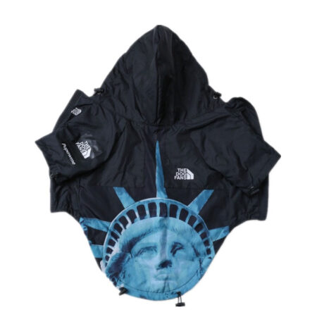 Black Supreme North Face inspired dog windbreaker with Liberty graphic on flat lay