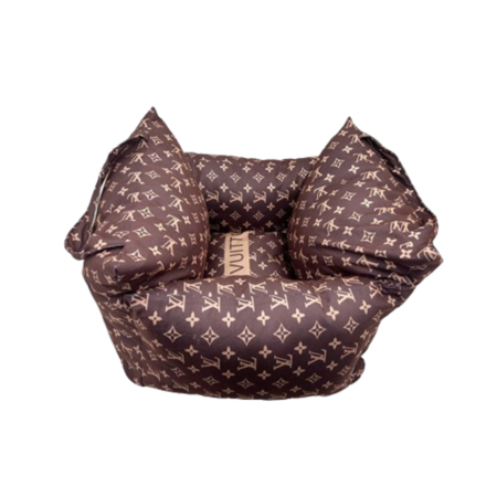 Luxury dog bed with raised sides and classic monogram print pattern