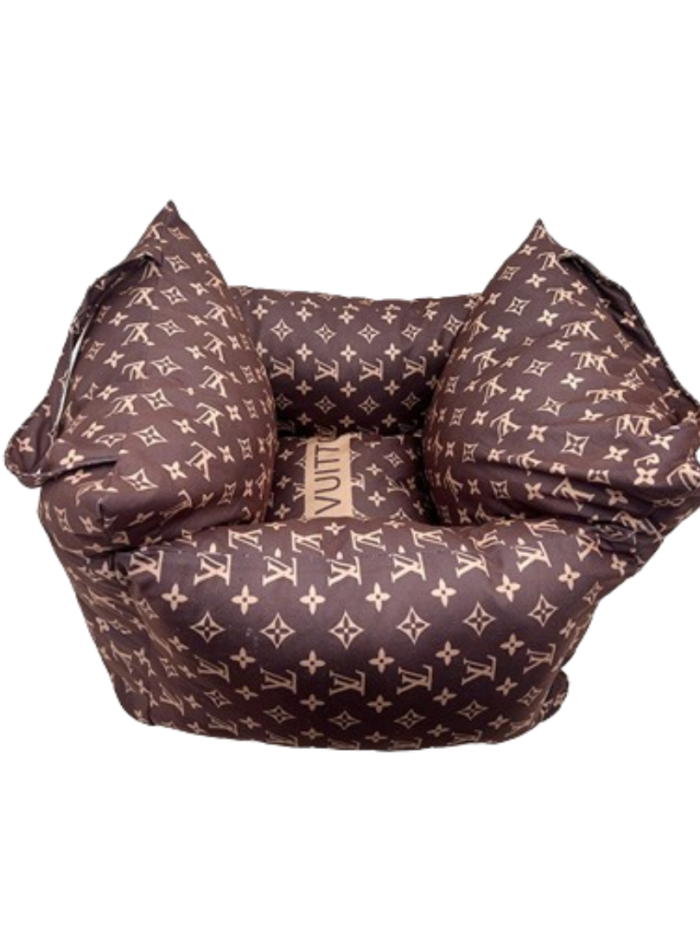 Luxury dog bed with raised sides and classic monogram print pattern