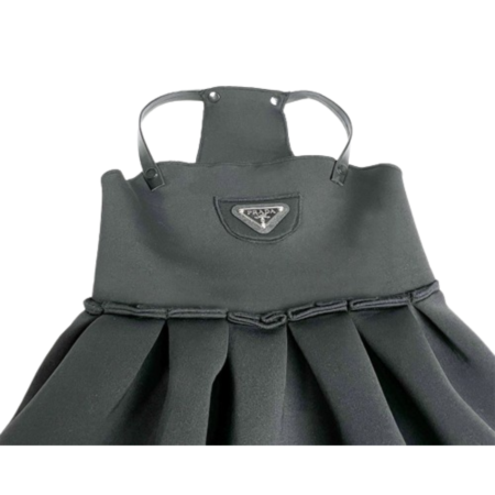 Close-up Pawda triangle logo on gray structured dog dress bodice