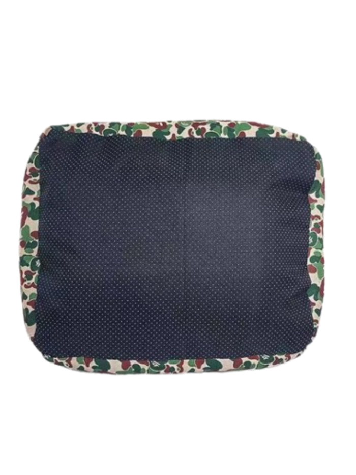 Bottom view showing non-slip textured base of camo dog bed