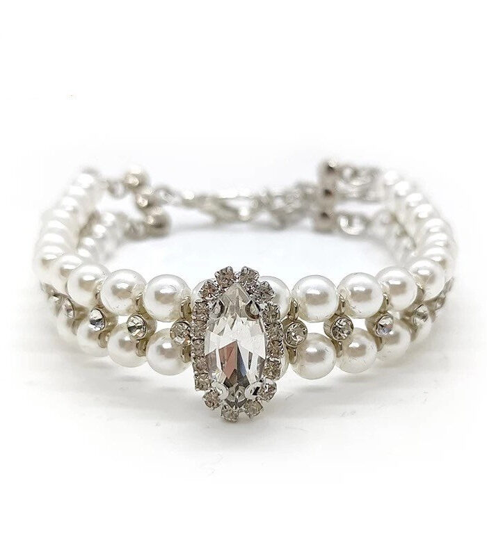 White faux pearl dog necklace with oval rhinestone centerpiece on white background