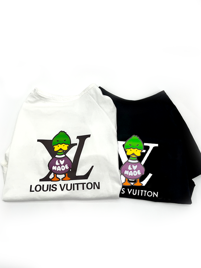 Black and white dog tees with cartoon duck LV style graphic laid flat