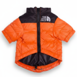 Orange and black quilted puffer jacket for dogs inspired by North Face Nuptse