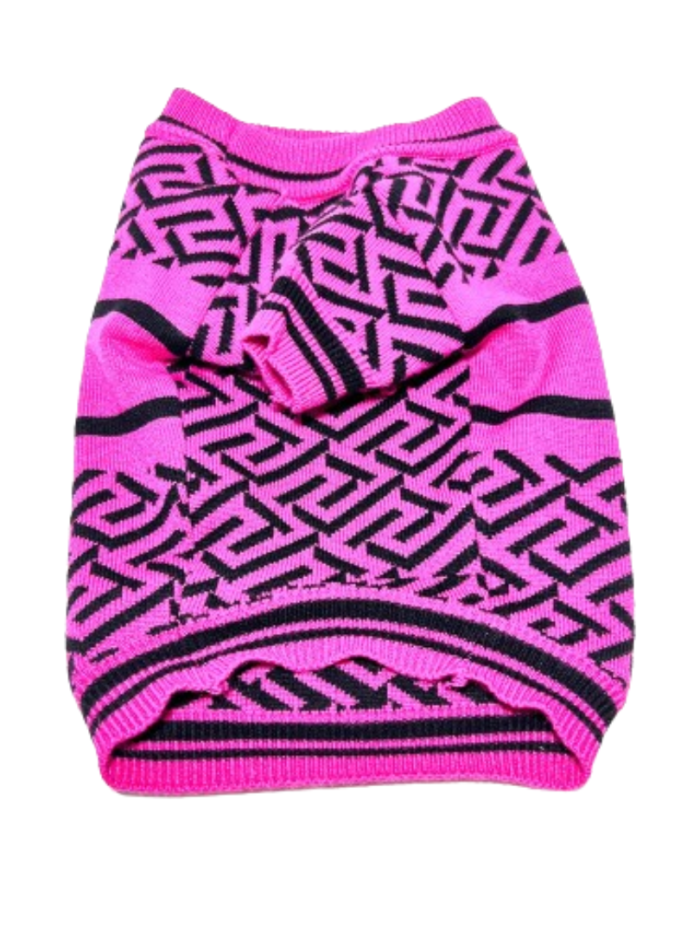 Pink knit dog sweater with black geometric pattern and medusa logo flat lay