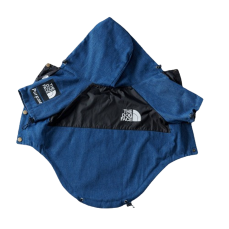 Blue denim dog jacket with black hood and TDF North Face logo patches flat lay
