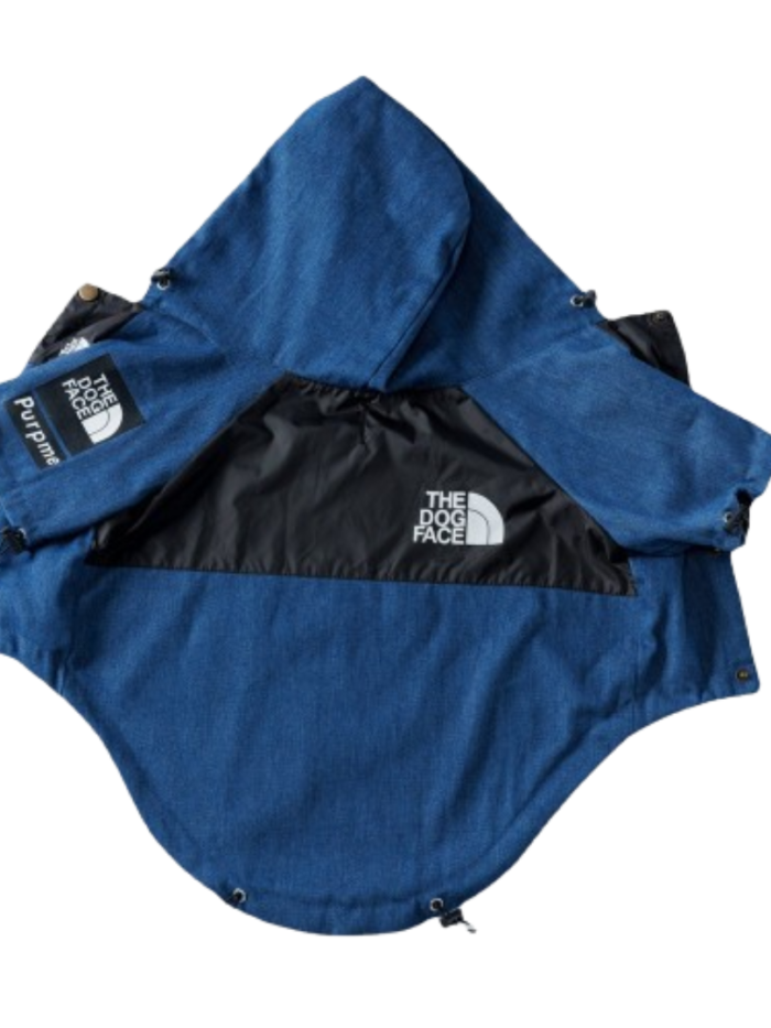 Blue denim dog jacket with black hood and TDF North Face logo patches flat lay