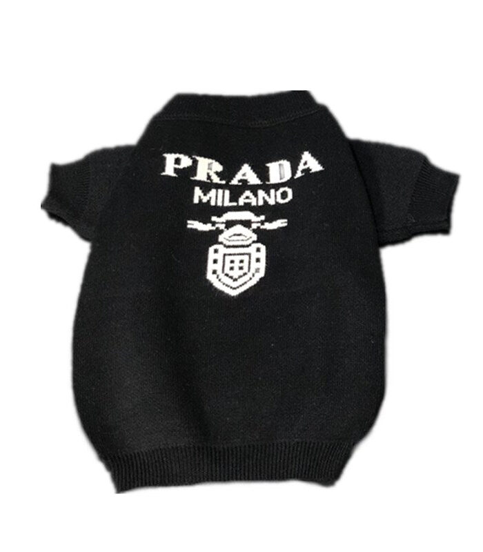 Black knit dog sweater with white Pawda Milano logo and crest on back