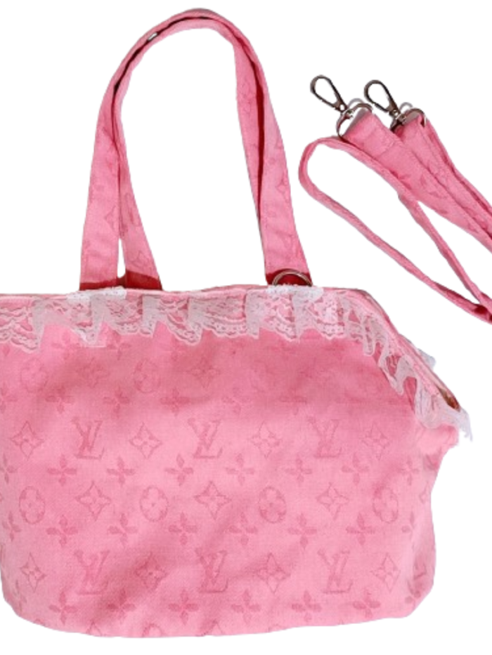 Pink monogram canvas dog carrier Louis Vuitton style with dual handles and shoulder strap