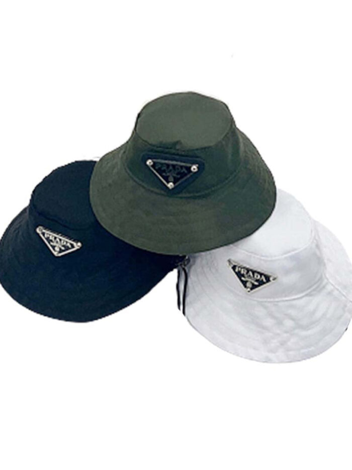 Three Pawda triangle logo bucket hats in black green and white colorways