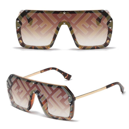 Brown gradient dog sunglasses with geometric monogram pattern and gold temples