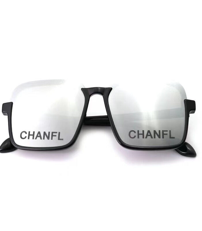 Black plastic dog sunglasses with Chanel branding on dark lenses