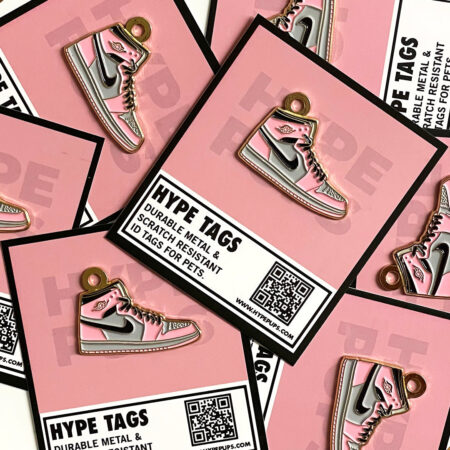Pink dog ID tags with Hype Tags packaging showing durable metal construction