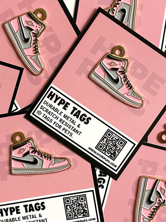 Pink dog ID tags with Hype Tags packaging showing durable metal construction