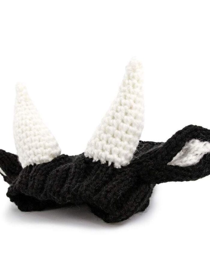 Black and white knit cow hat with horns and ears for dogs