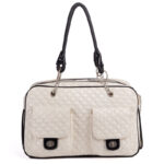 White quilted dog carrier with braided chain handles and front pockets Chanel style