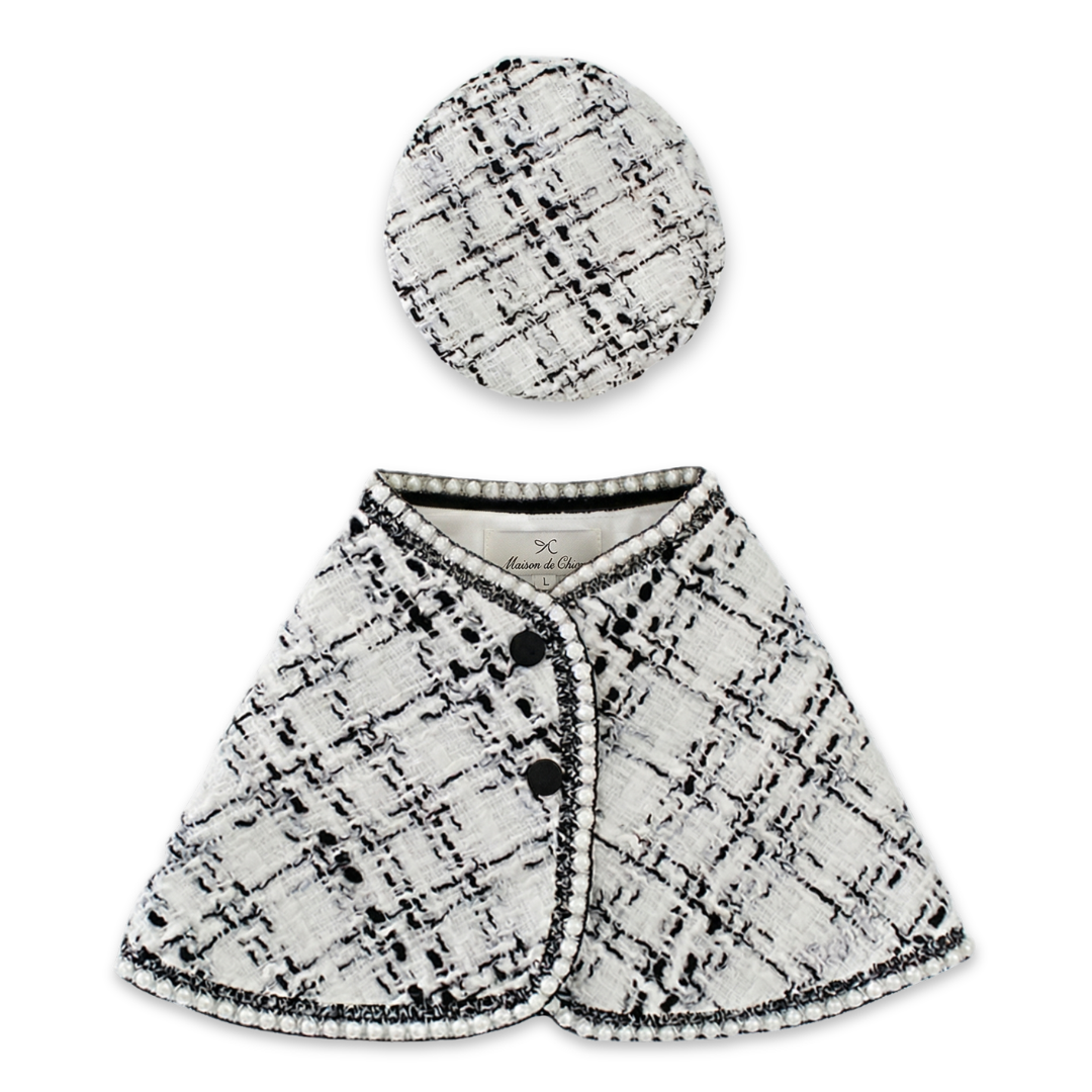 White bouclé tweed dog cape with black pearl trim and coordinating beret Chanel style