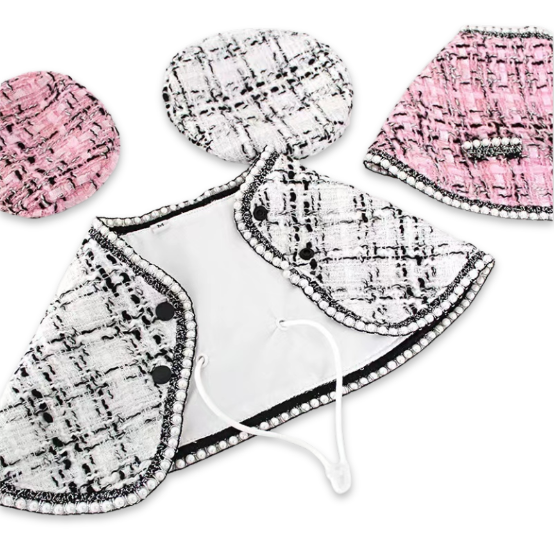 Pink and white bouclé dog capes with berets laid flat showing Chanel inspired design