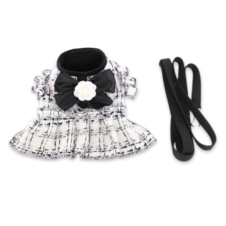 White tweed dog harness dress with black bow and flower detail Chanel style