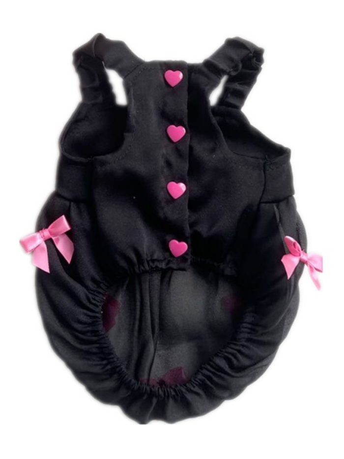 Back view black dog dress with pink heart buttons and bow details on ruffle skirt