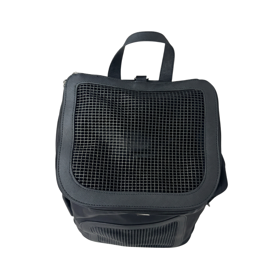 Detail view of black nylon dog backpack carrier with triangle logo badge