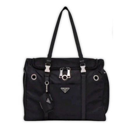 Black nylon dog travel carrier with Prada triangle logo and mesh ventilation panels
