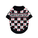 Black and white checkered dog sweater with red hearts and Dogior branding on white background
