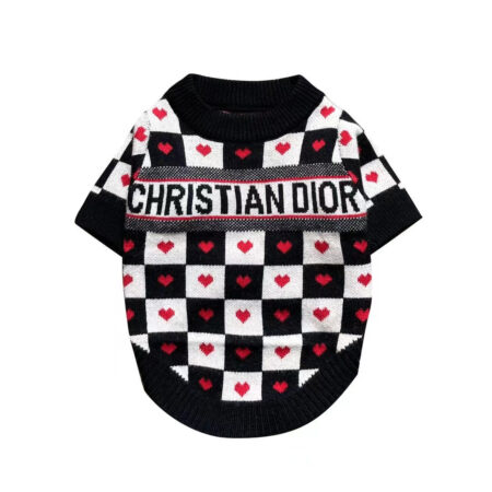 Black and white checkered dog sweater with red hearts and Dogior branding on white background