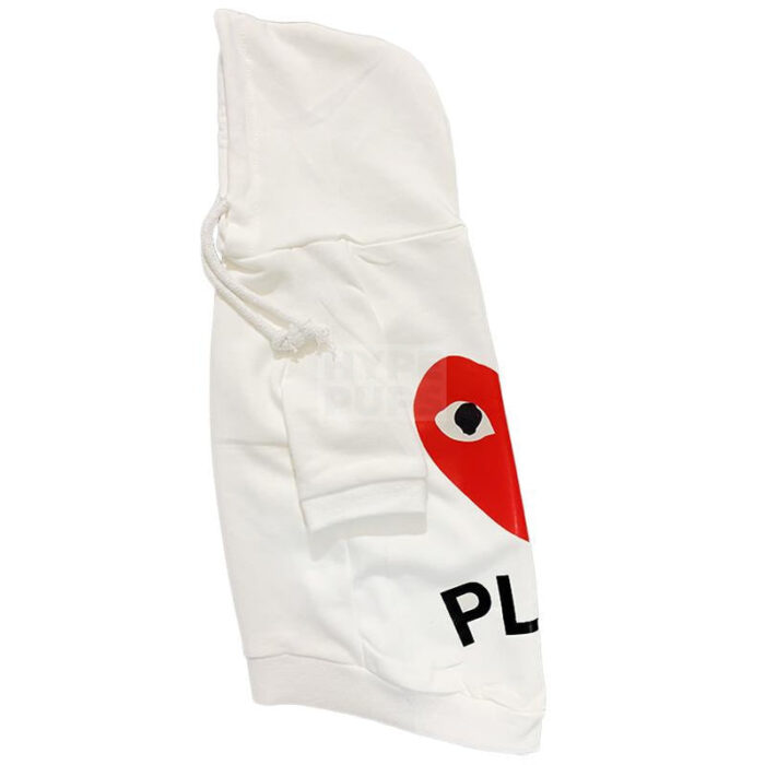 Side view of white CDG dog hoodie showing partial red heart logo