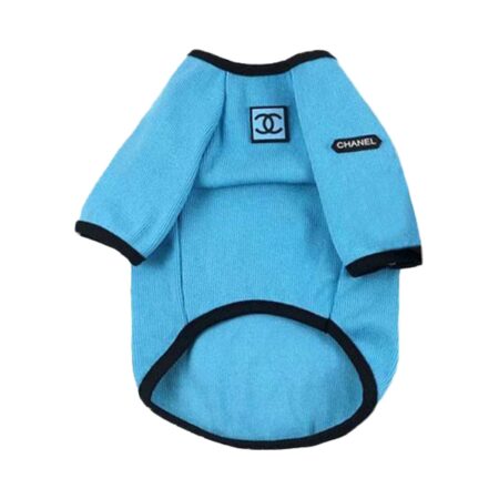 Blue waffle-knit dog sweatshirt with Chanel logo patches on white background