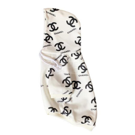 White Chanel inspired dog hoodie with interlocking logo pattern flat lay