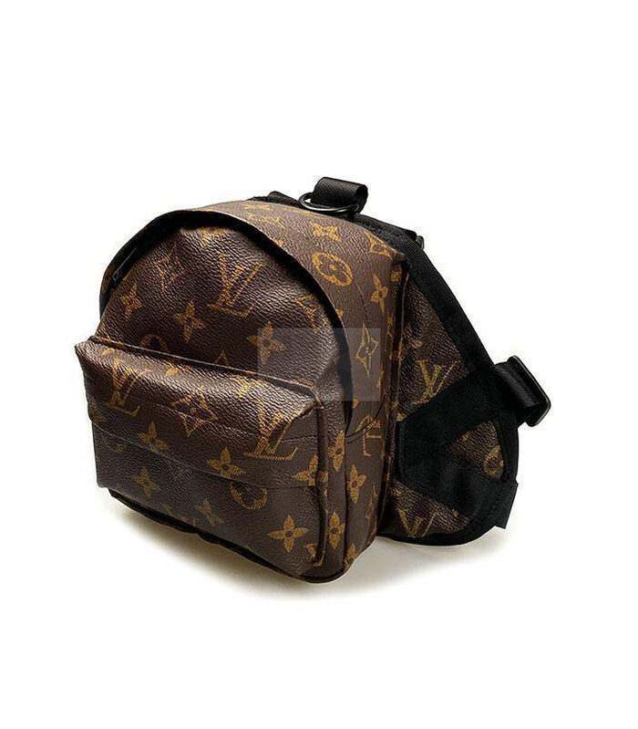Brown monogram dog backpack side angle showing adjustable straps and compartments