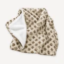 Beige monogram plush dog blanket inspired by Louis Vuitton, folded to show the white reverse