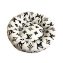 White round dog bed with black Louis Vuitton inspired V monogram pattern and plush construction