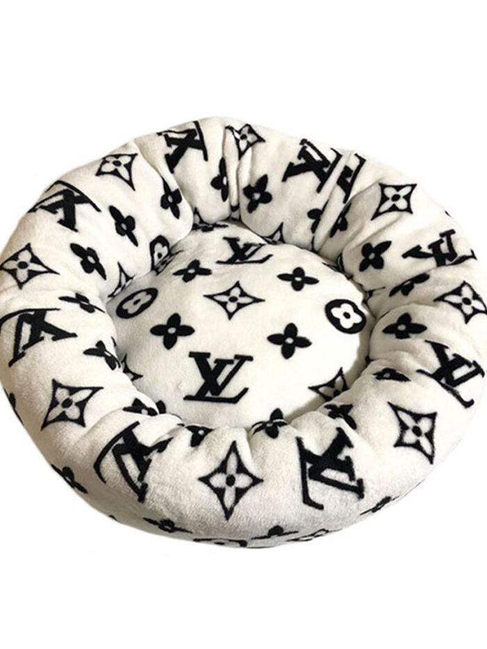 White round dog bed with black Louis Vuitton inspired V monogram pattern and plush construction