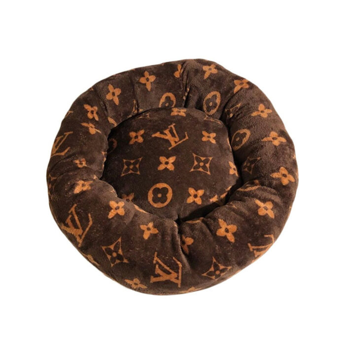 Brown round dog bed with tan Louis Vuitton style V monogram pattern donut shape