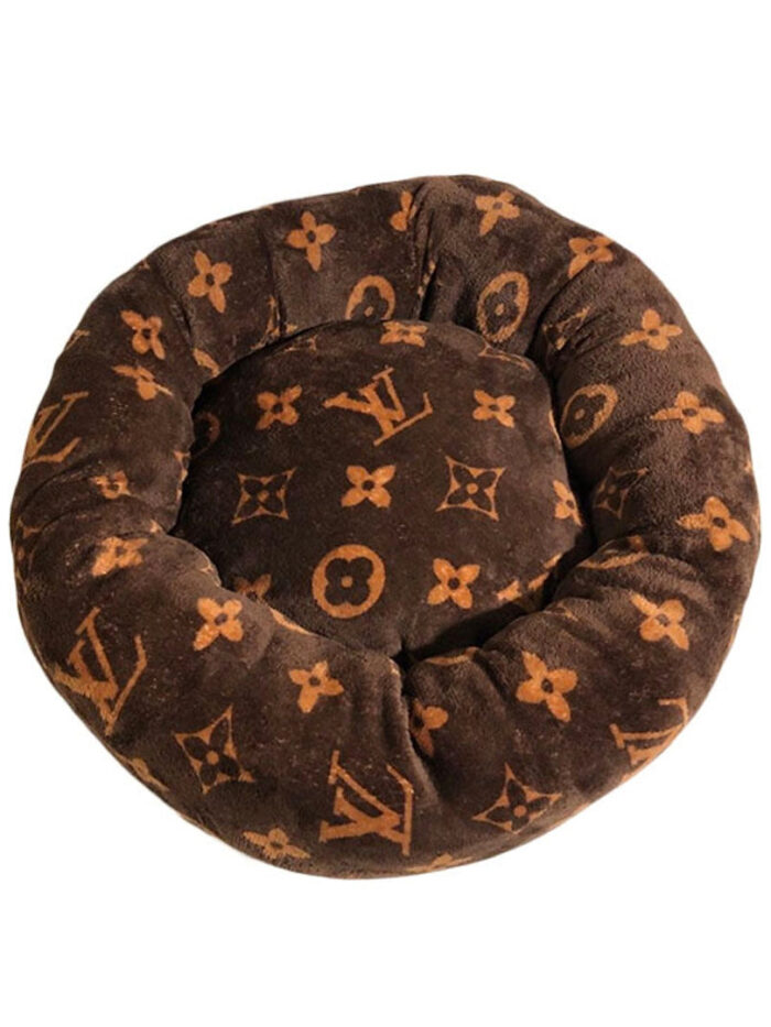 Brown round dog bed with tan Louis Vuitton style V monogram pattern donut shape