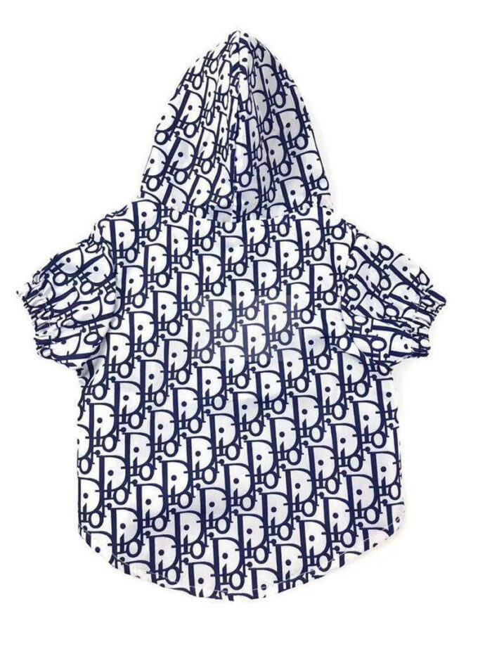 White dog windbreaker with navy Dior monogram print laid flat on white background