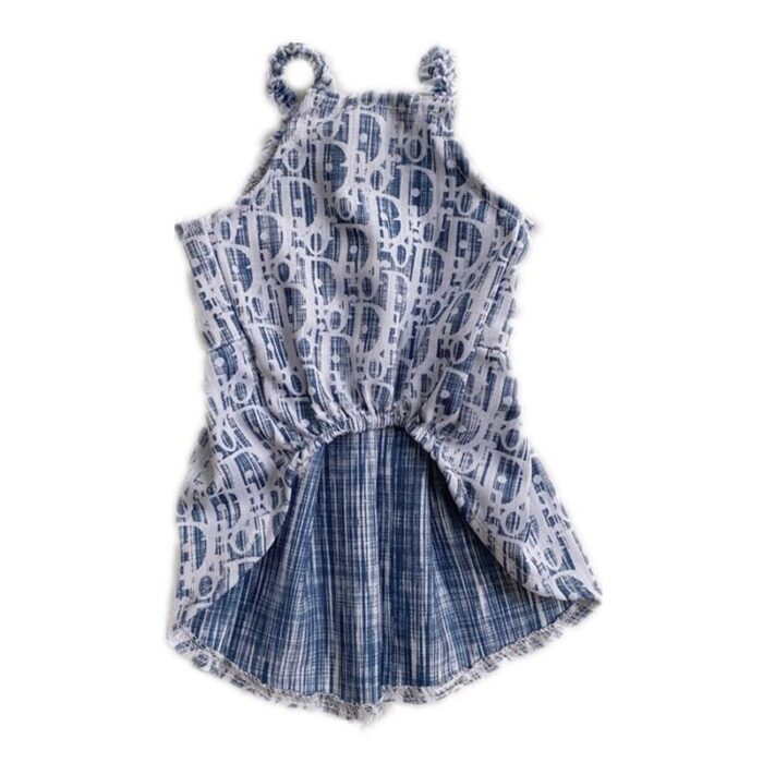 Back view of oblique print dog dress showing pleated skirt construction Dior style