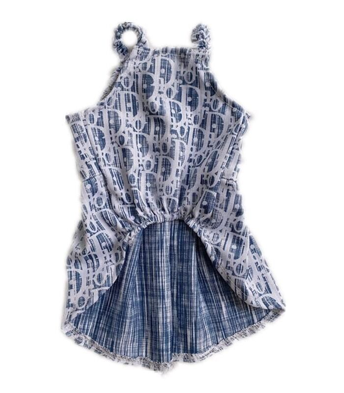 Back view of oblique print dog dress showing pleated skirt construction Dior style