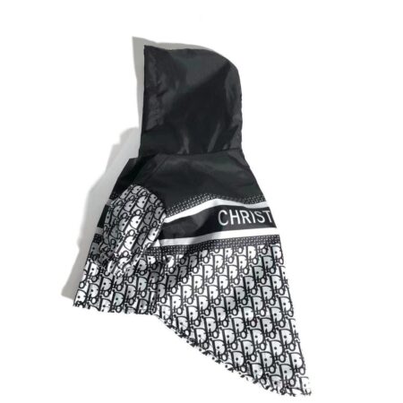 Side view of dog windbreaker showing oblique print pattern and hooded design