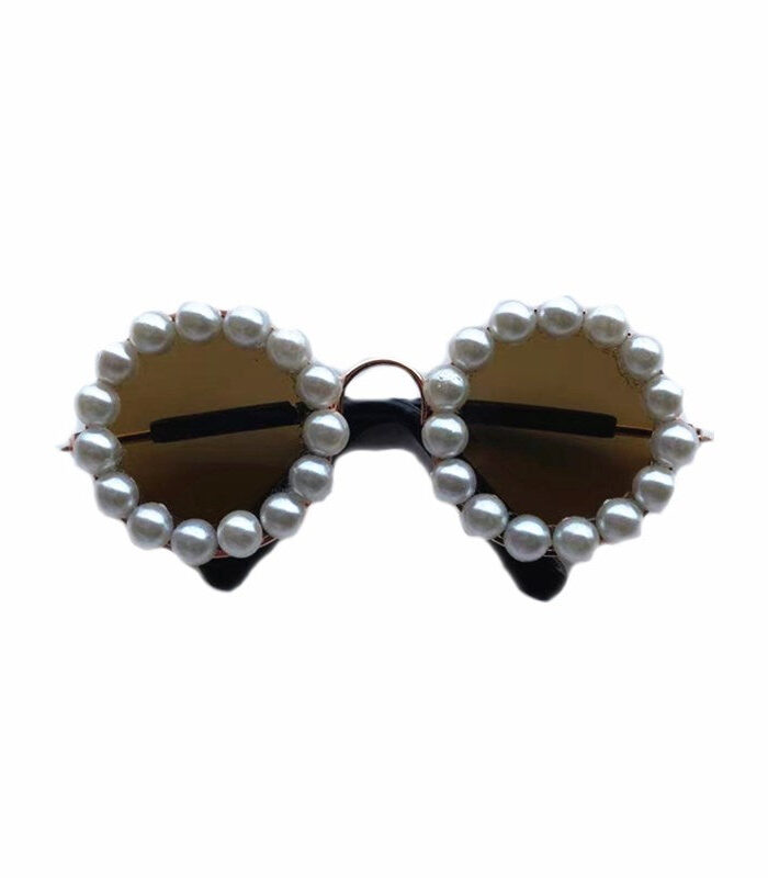 Black dog sunglasses with white faux pearl rim detail and tinted lenses Chanel inspired