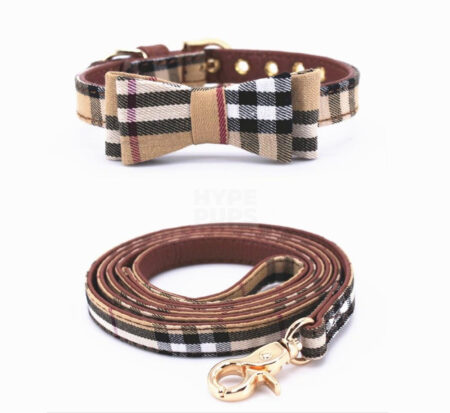 Tan plaid dog collar with bow detail and matching leash inspired by Burberry on white background