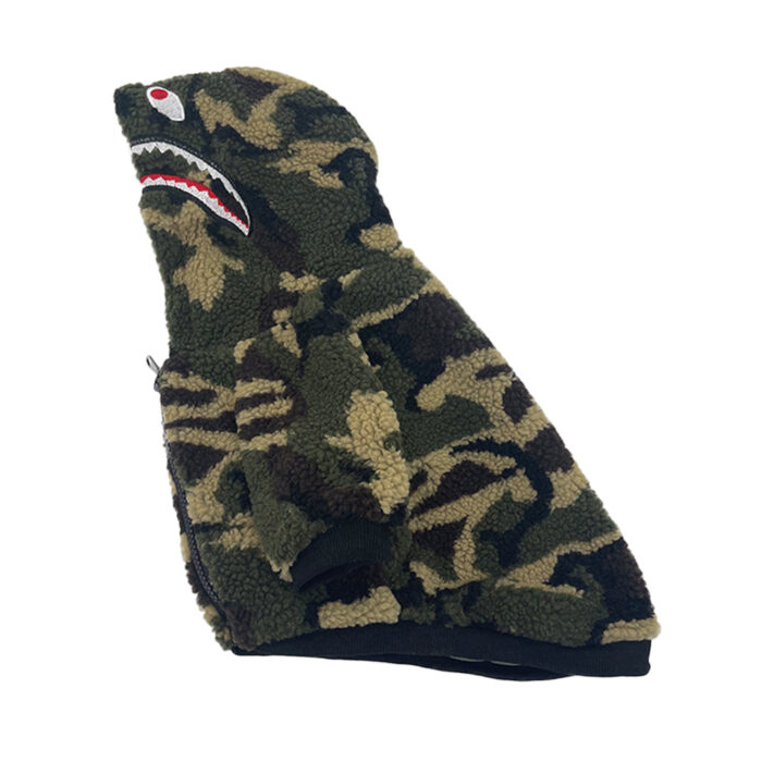 Side view of camo dog hoodie showing shark mouth detail and red eyes on hood