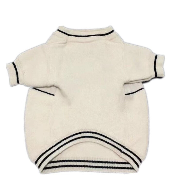 Back view of cream dog sweater with ribbed collar and black stripe details