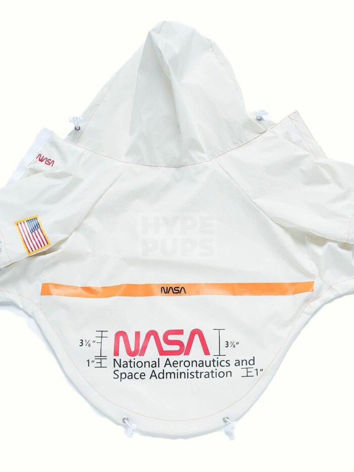 White NASA windbreaker flat lay showing 3M reflective orange stripe and mission patch