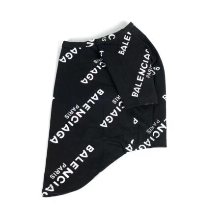 Flat lay black cotton dog t-shirt with repeated white logo text pattern