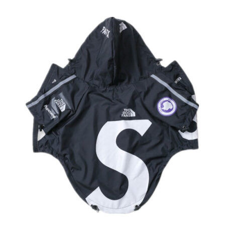 Black dog windbreaker flat lay with oversized white S logo Supreme x North Face collaboration style
