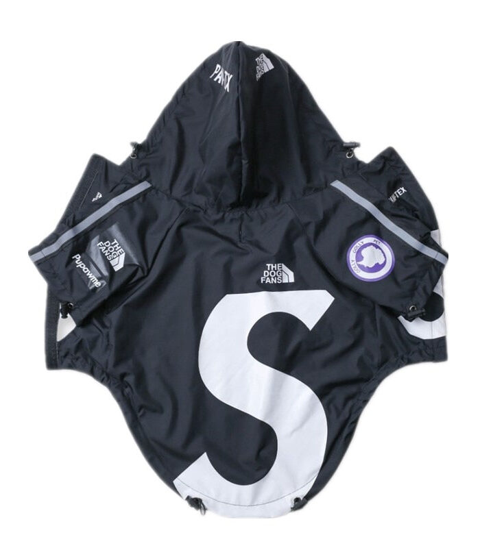 Black dog windbreaker flat lay with oversized white S logo Supreme x North Face collaboration style